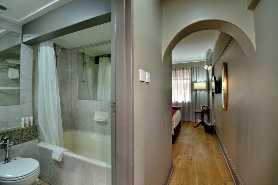 Standard Room, 1 Twin Bed, City View | Bathroom | Deep soaking tub, free toiletries, hair dryer, towels