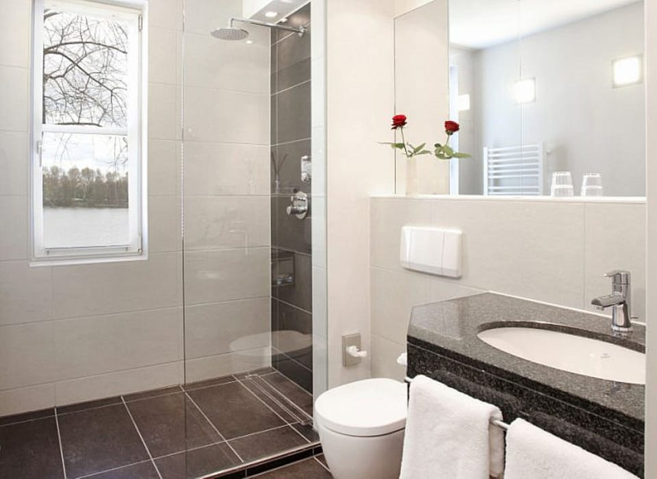 Shower, hair dryer, bathrobes, towels