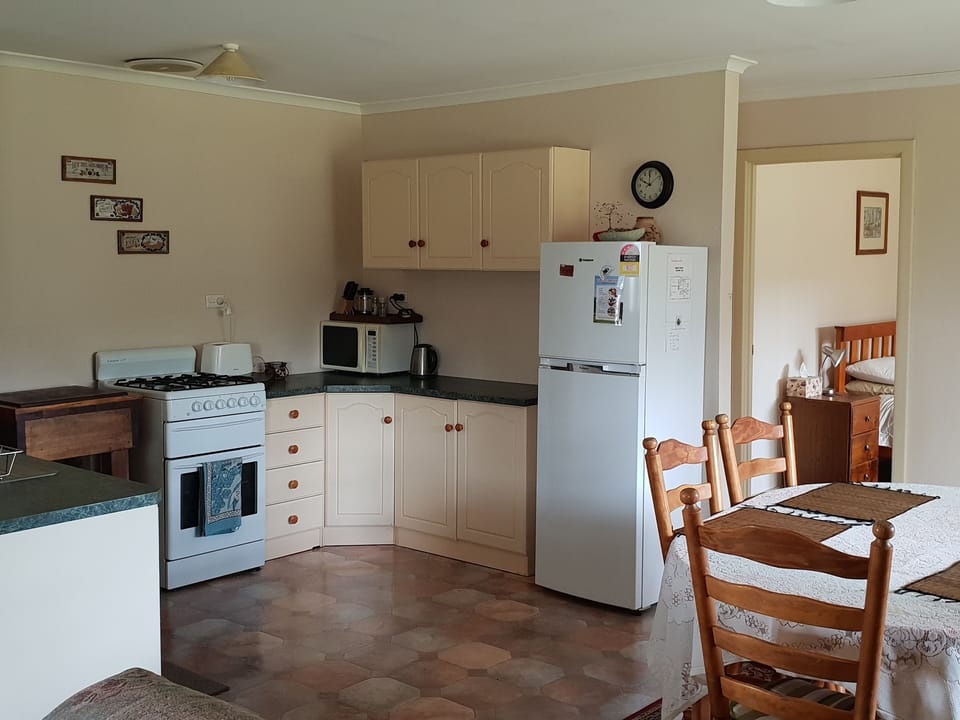 Ruby Cottage | Private kitchen | Fridge, microwave, oven, stovetop