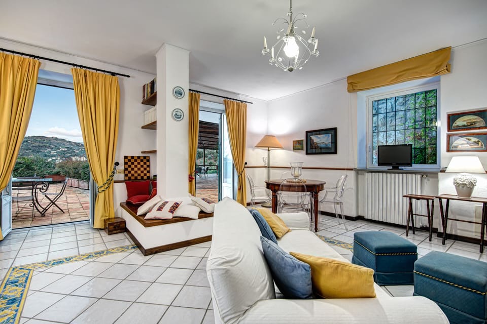 Family Villa | Living area | 19-inch flat-screen TV with satellite channels, TV, fireplace
