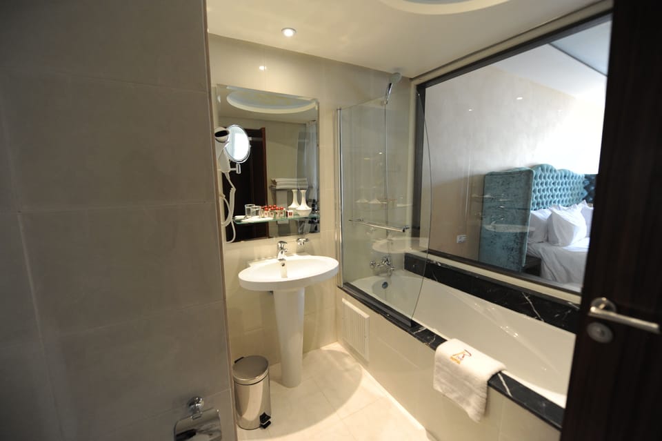 Deep soaking tub, rainfall showerhead, free toiletries, hair dryer