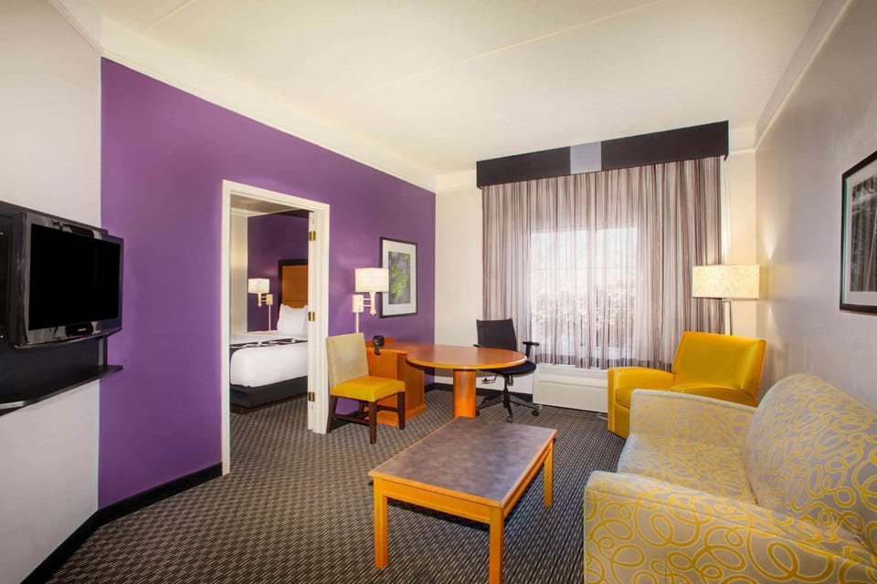 Premium bedding, desk, laptop workspace, iron/ironing board