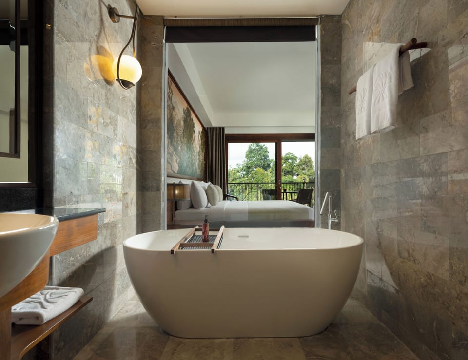 Adiwana Room | Bathroom | Separate tub and shower, rainfall showerhead, hair dryer, bathrobes