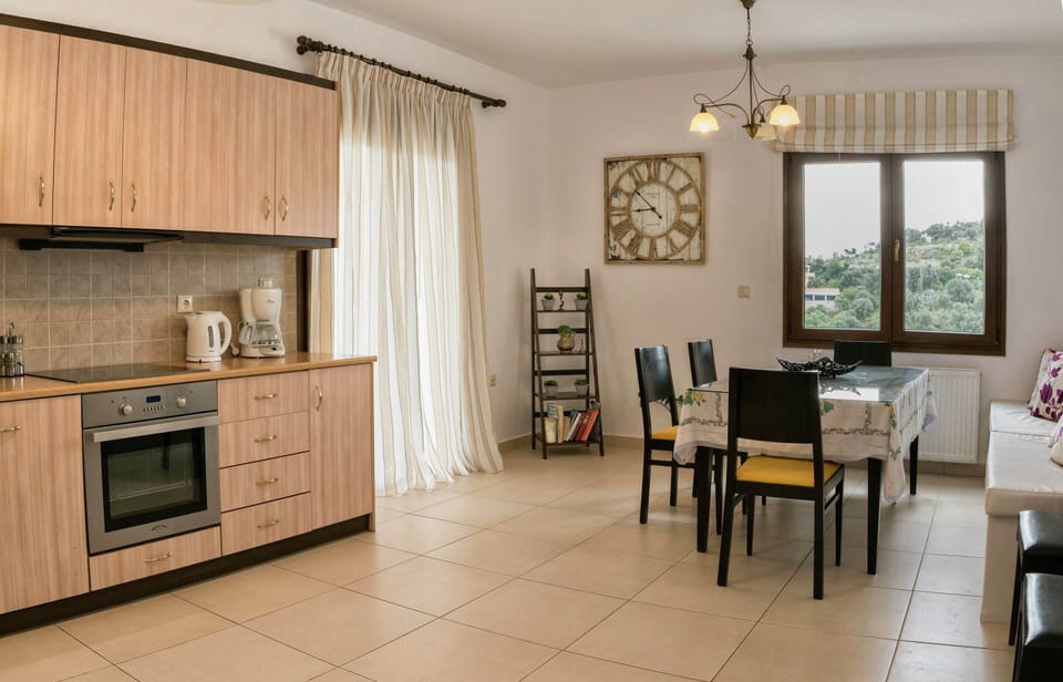 Villa | Private kitchen | Stovetop, coffee/tea maker, highchair, cookware/dishes/utensils