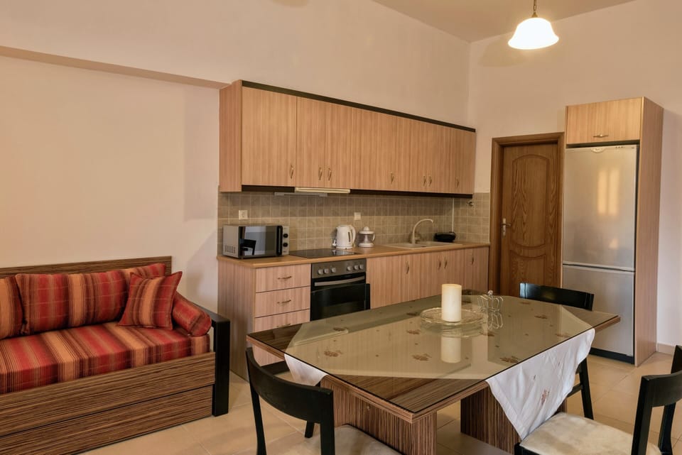 Villa | Private kitchen | Stovetop, coffee/tea maker, highchair, cookware/dishes/utensils