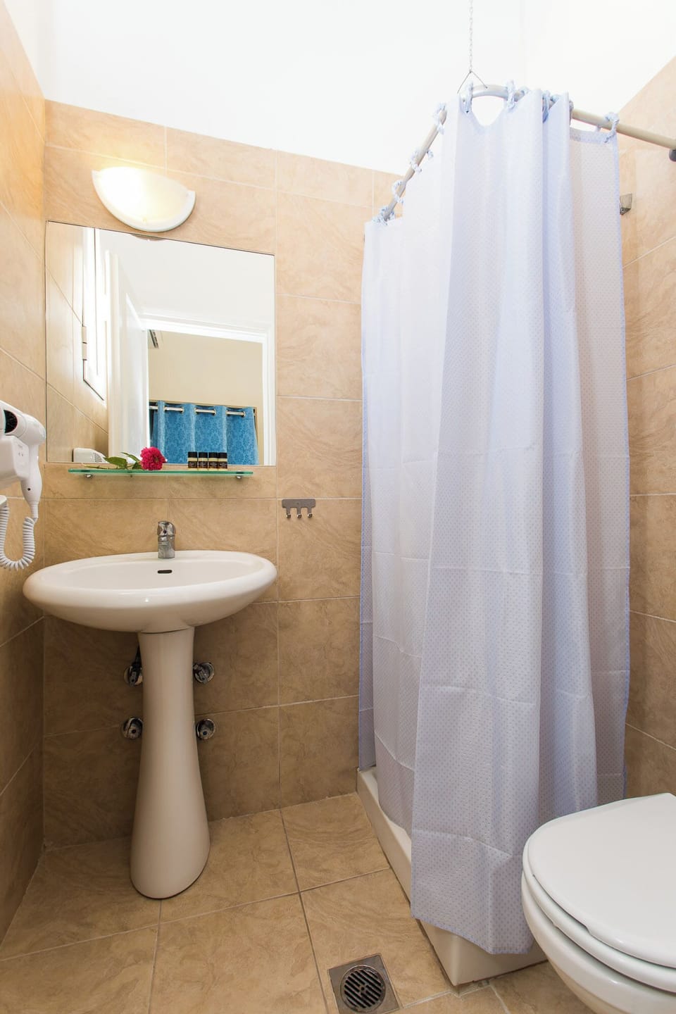 Shower, free toiletries, hair dryer, slippers