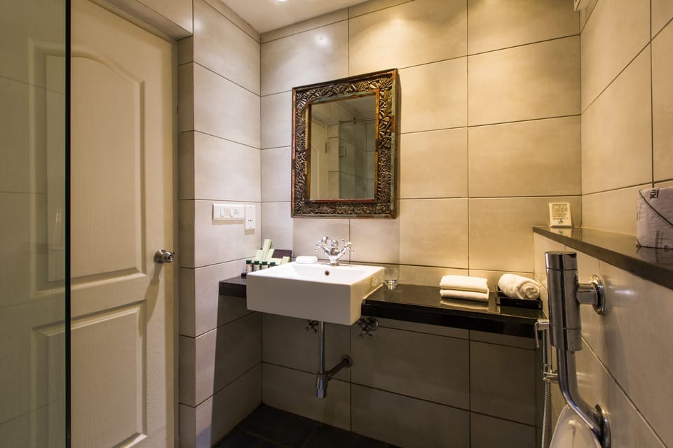 Shower, rainfall showerhead, designer toiletries, hair dryer