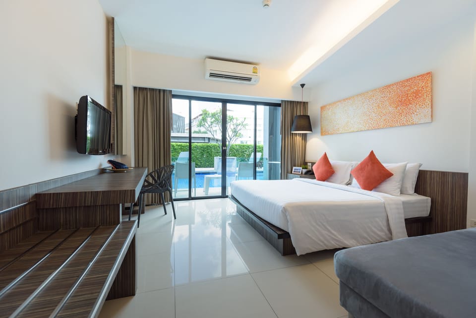 Deluxe Room, Pool Access | In-room safe, desk, blackout drapes, free WiFi