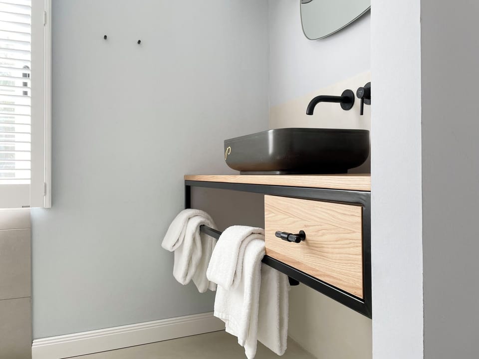 Shower, rainfall showerhead, eco-friendly toiletries, towels