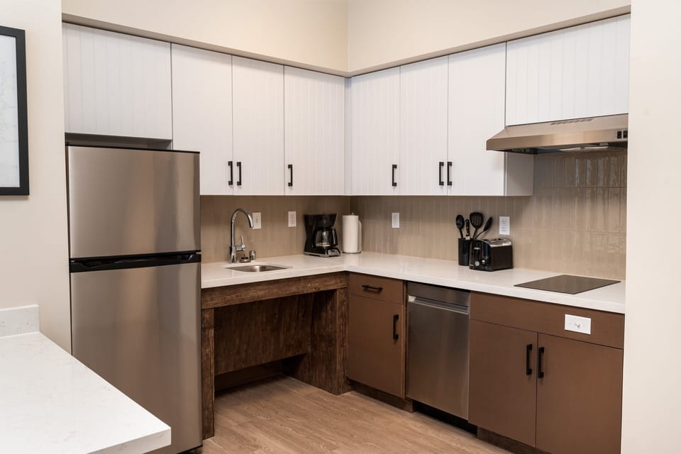 Desk, blackout drapes, iron/ironing board, free cribs/infant beds