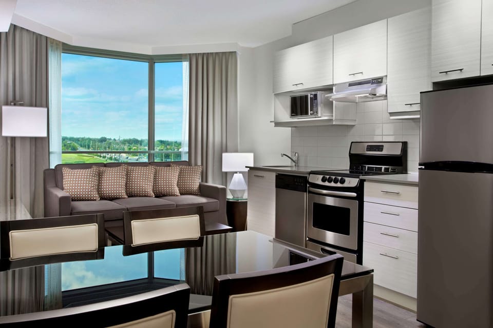 Deluxe Suite, 1 King Bed, Kitchen | Living area | TV, pay movies