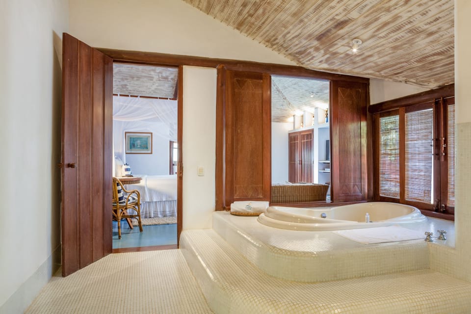 Bungalow Master | Bathroom | Designer toiletries, hair dryer, bathrobes, towels