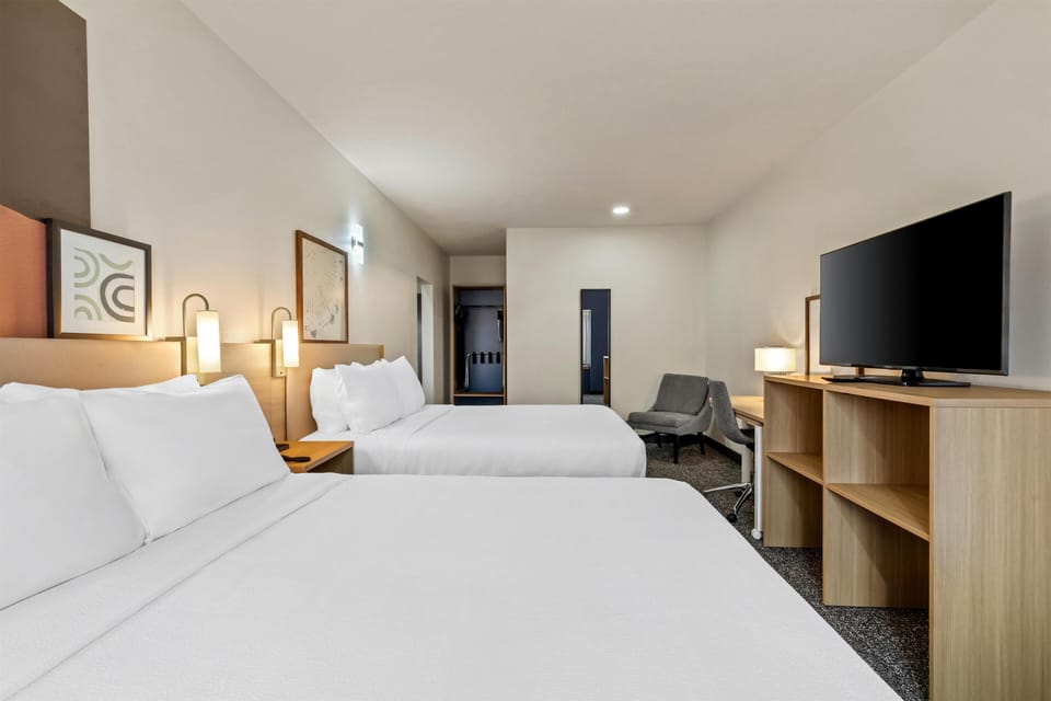 Suite, Multiple Beds | Desk, laptop workspace, blackout drapes, iron/ironing board