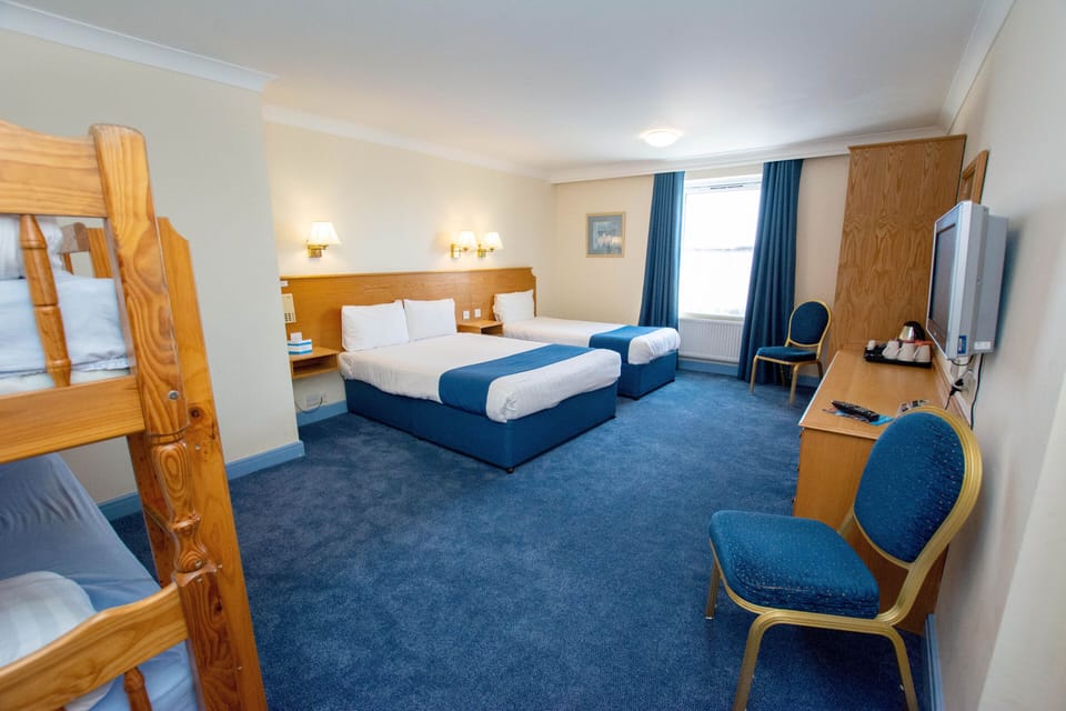 Family Quadruple Room (2 Adults + 2 Children) | In-room safe, desk, free WiFi, bed sheets