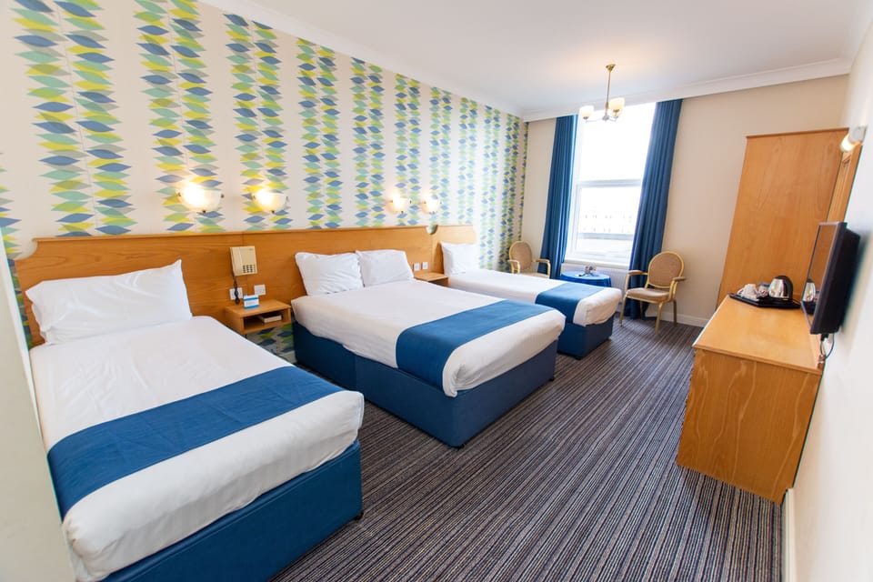 Family Quadruple Room (2 Adults + 2 Children) | In-room safe, desk, free WiFi, bed sheets