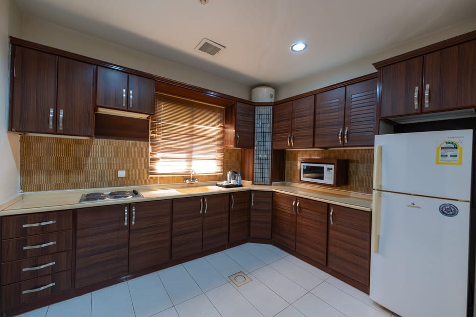 Two Bedrooms Apartment | Private kitchen | Oven, stovetop, cookware/dishes/utensils, eco-friendly cleaning products