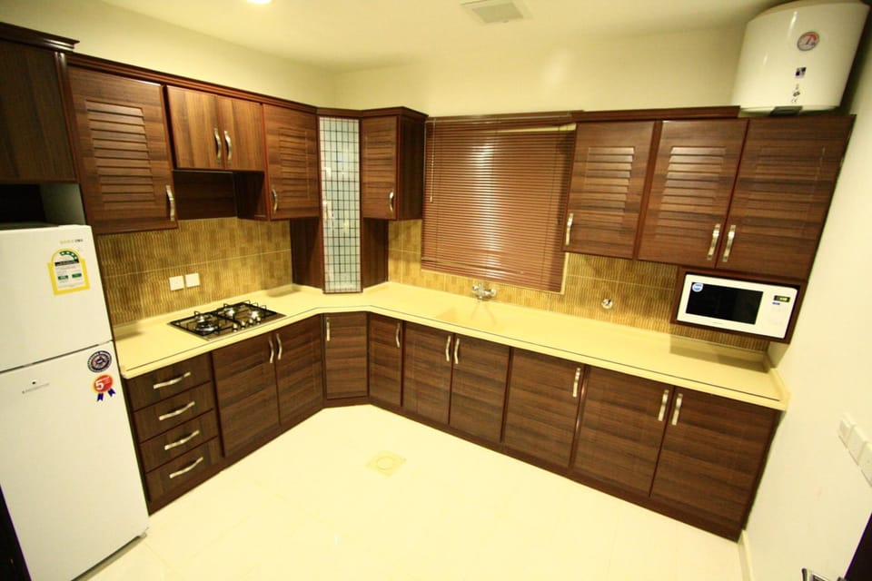 Three Bedrooms Apartment | Private kitchen | Oven, stovetop, cookware/dishes/utensils, eco-friendly cleaning products