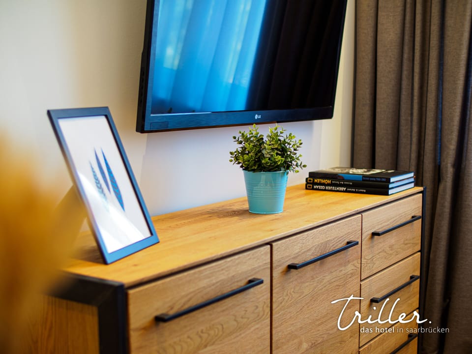 Comfort Apartment | Living area | 50-inch Smart TV with satellite channels, streaming services