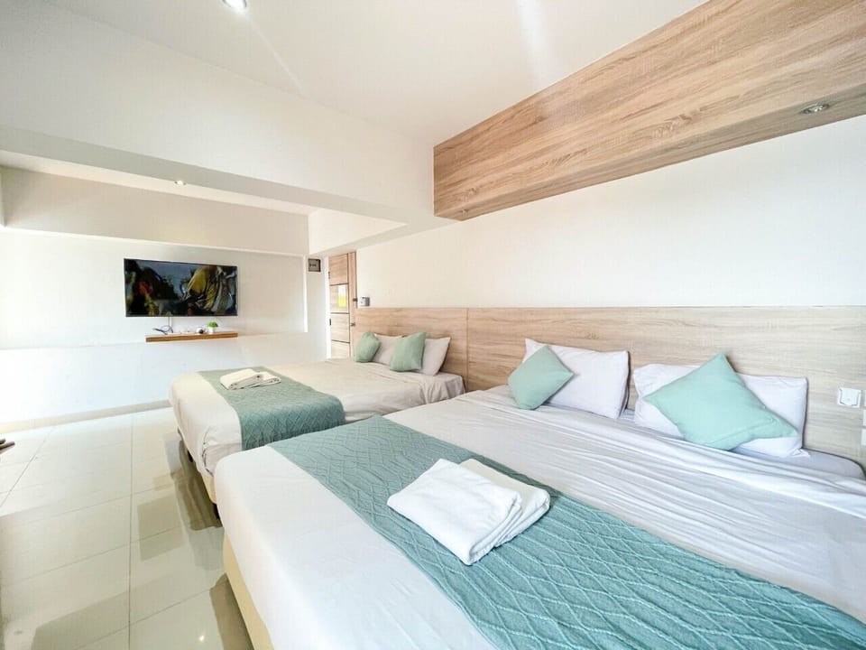 Family Room, 2 King Beds | Blackout drapes, free WiFi, bed sheets, wheelchair access