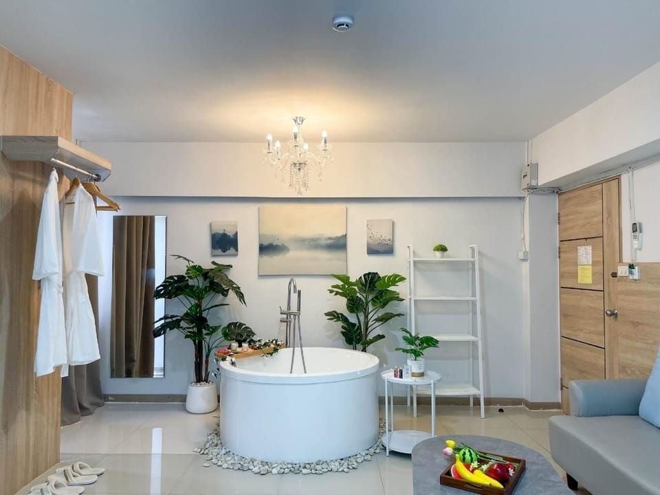 Premium Room, 1 King Bed, Non Smoking, Bathtub | Living area | 50-inch Smart TV with cable channels, TV