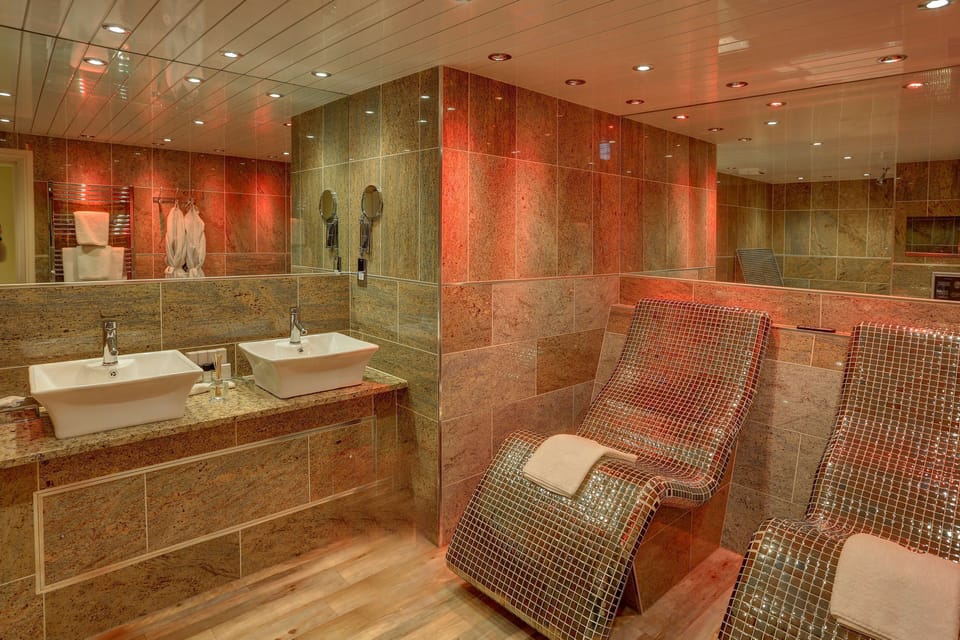 Suite, 1 King Bed | Bathroom | Hydromassage showerhead, eco-friendly toiletries, hair dryer, bathrobes