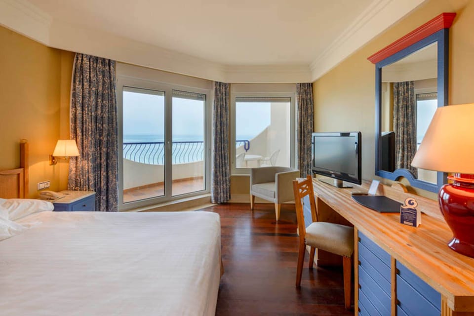 Double Room, Sea View | Minibar, in-room safe, desk, laptop workspace