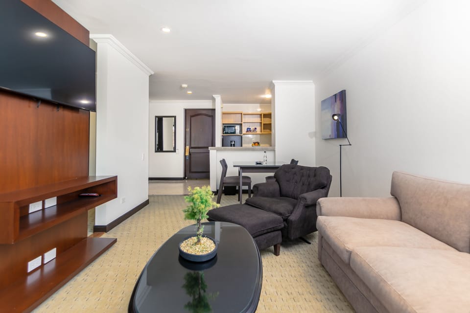 Executive Studio Suite, 1 King Bed, Kitchen | Living area | 50-inch LCD TV with cable channels, TV, fireplace
