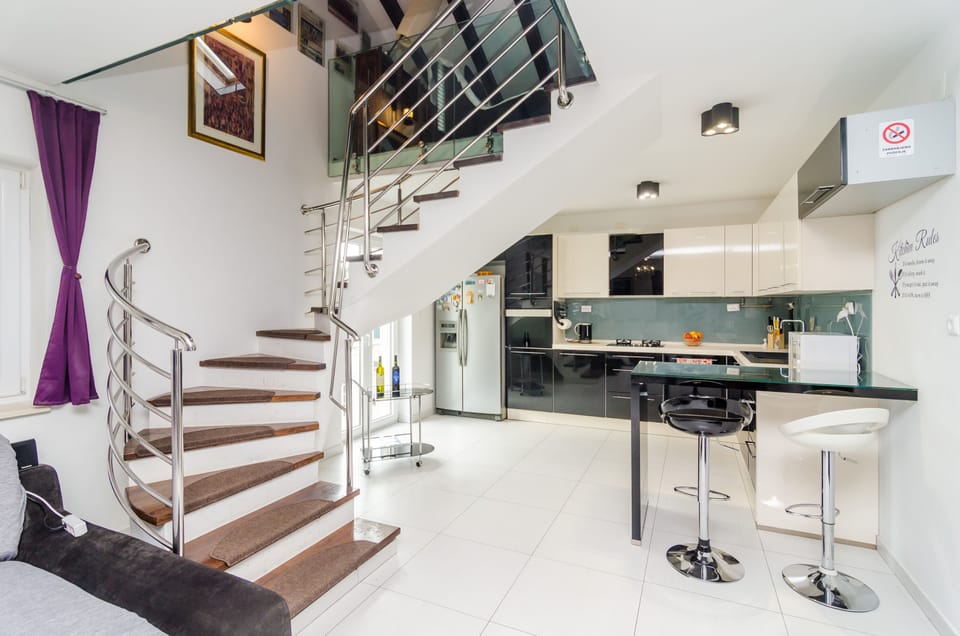 Apartment (Four Bedroom Duplex Apartment) | Living room | 25-inch flat-screen TV with cable channels, TV, DVD player