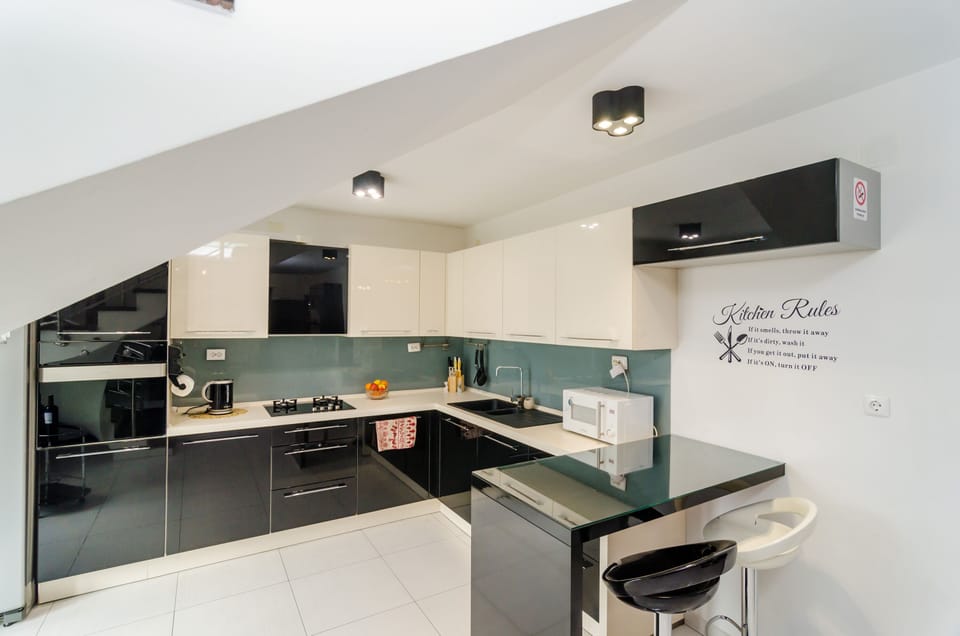 Apartment (Four Bedroom Duplex Apartment) | Private kitchen | Fridge