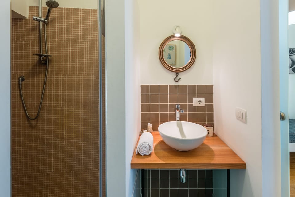 Quadruple Room | Bathroom | Shower, hair dryer, bidet, soap