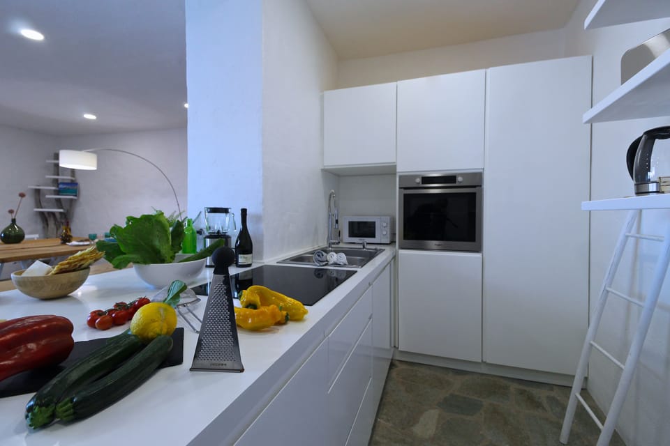 Villa, Beachfront | Private kitchen | Full-size fridge, microwave, oven, stovetop