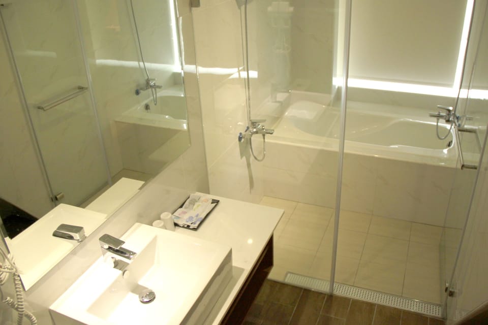 Deep soaking tub, hair dryer, slippers, towels