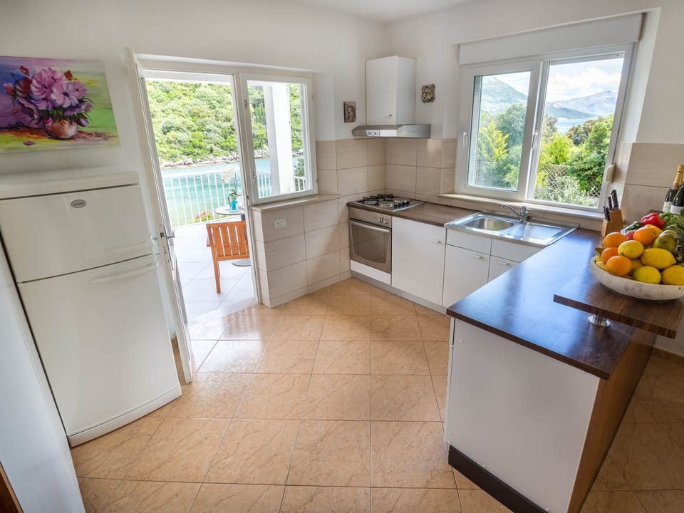 Apartment (Two-Bedroom Apartment with Sea View) | Private kitchen | Fridge