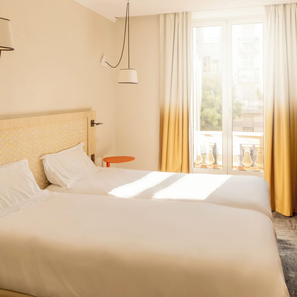 Comfort Double or Twin Room | Minibar, in-room safe, desk, blackout drapes