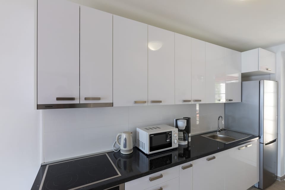 Apartment (Three Bedroom Apartment) | Private kitchen | Fridge, microwave, stovetop, dishwasher
