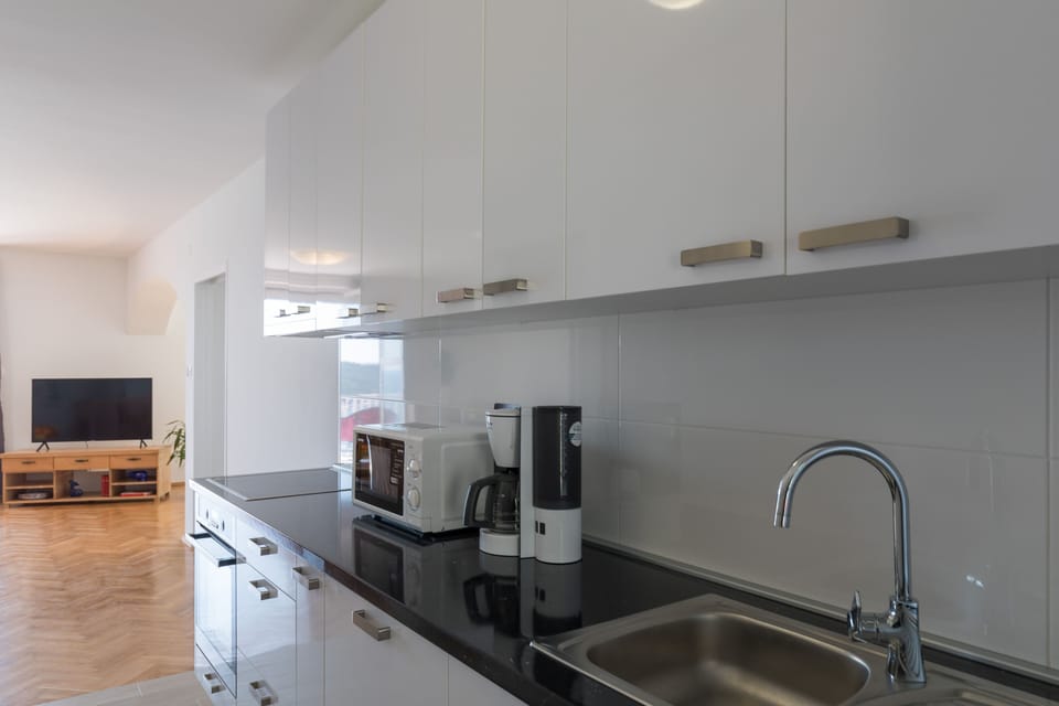 Apartment (Three Bedroom Apartment) | Private kitchen | Fridge, microwave, stovetop, dishwasher