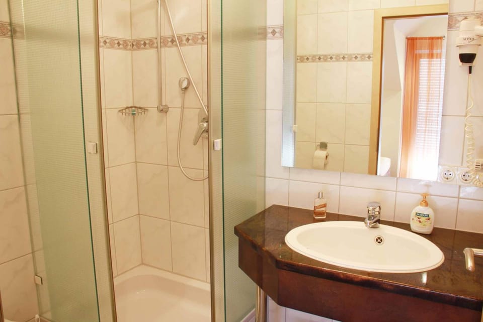 Shower, hair dryer (on request), towels