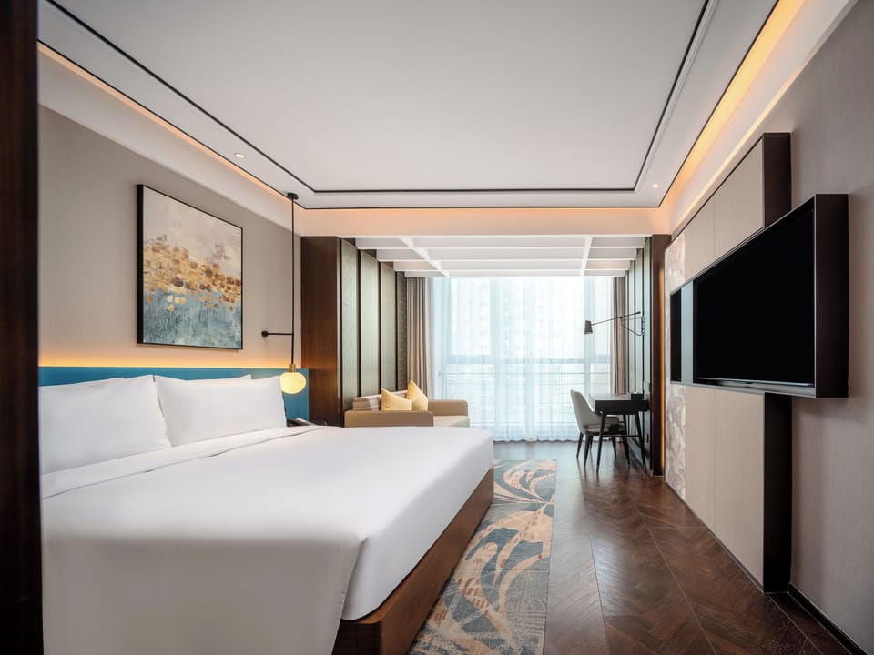 Deluxe Room, 1 King Bed with Sofa bed | Down comforters, memory foam beds, in-room safe, desk