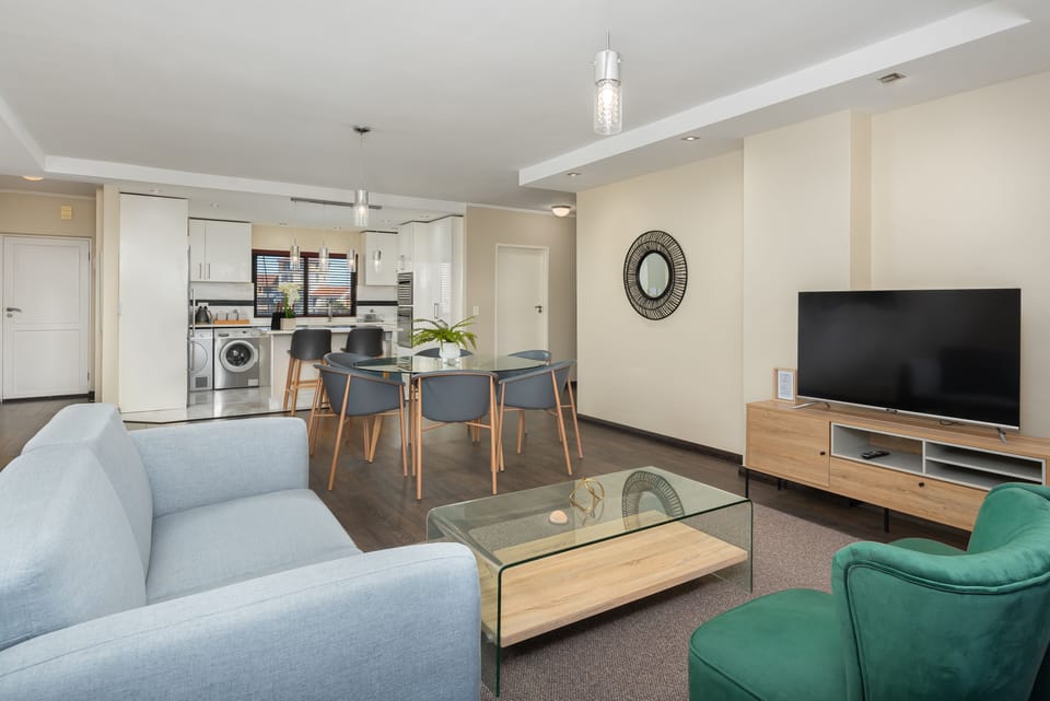 Luxury Apartment | Living area | Flat-screen TV