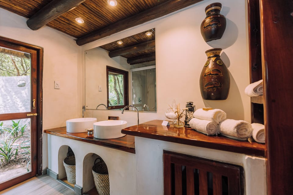 Luxury Suite, 1 King Bed | Bathroom | Separate tub and shower, free toiletries, slippers, towels