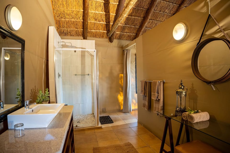 Luxury Tent, Private Bathroom, Mountain View | Bathroom | Shower, rainfall showerhead, hair dryer, towels