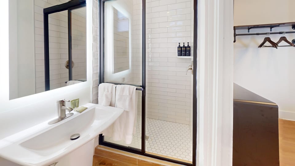 Premium Suite, 2 Bedrooms | Bathroom | Shower, free toiletries, towels, soap