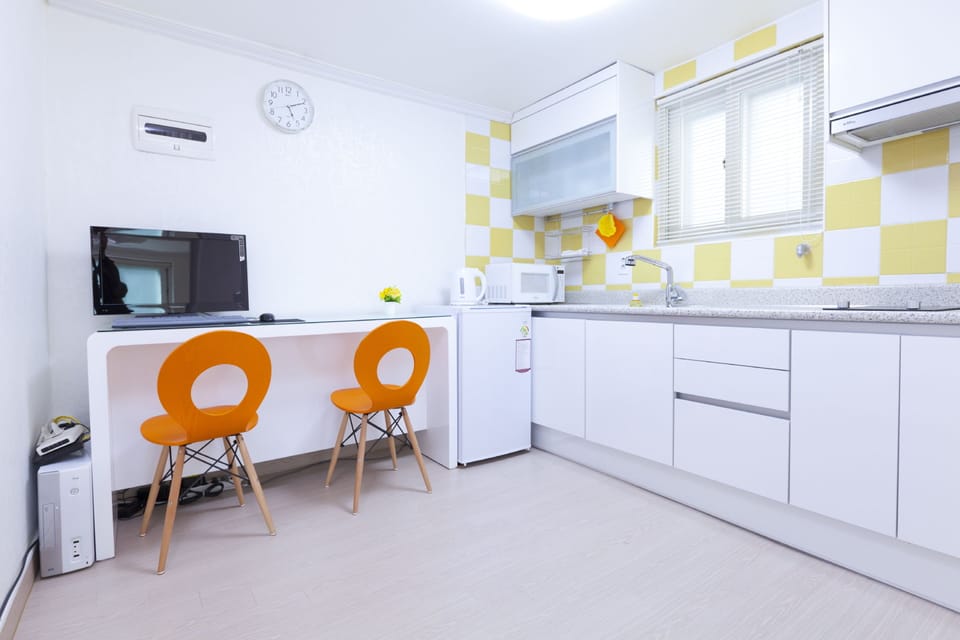 (Foreigners Only) Family Suite | Living area | LED TV, computer