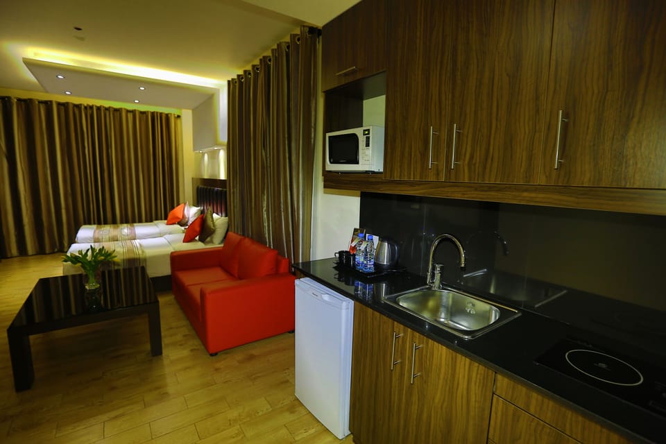 Executive Room | Premium bedding, minibar, in-room safe, blackout drapes