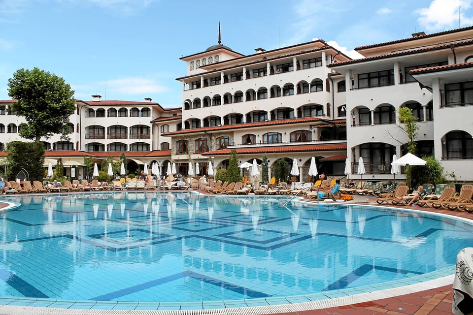 Indoor pool, outdoor pool, open 9 AM to 7 PM, pool umbrellas