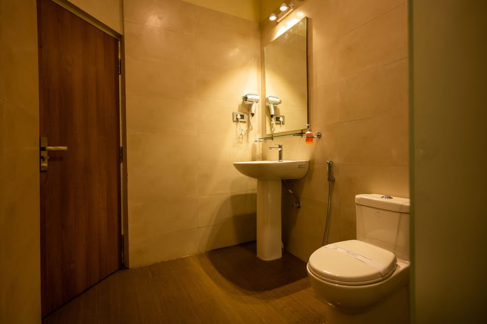 Shower, free toiletries, hair dryer, slippers