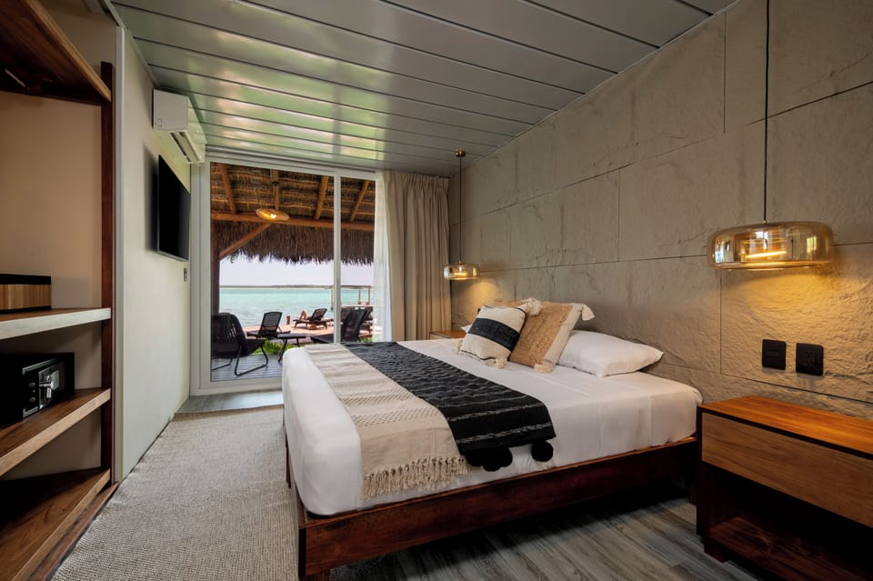 Premium Room, Lagoon View | Down comforters, minibar, individually decorated, individually furnished