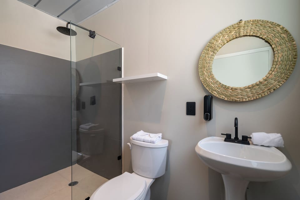 Shower, rainfall showerhead, designer toiletries, hair dryer