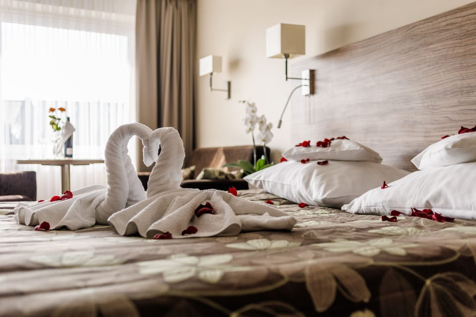 Quadruple Room | Desk, blackout drapes, cribs/infant beds, rollaway beds