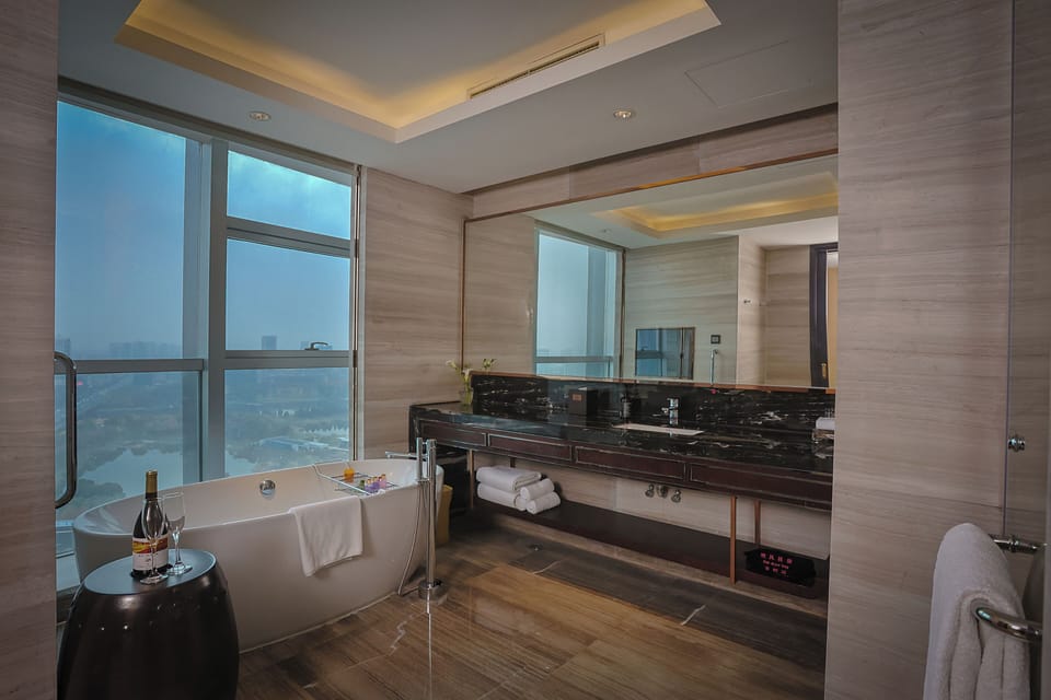 King One Bedroom Suite Lounge Access | Bathroom | Combined shower/tub, deep soaking tub, hair dryer, bathrobes